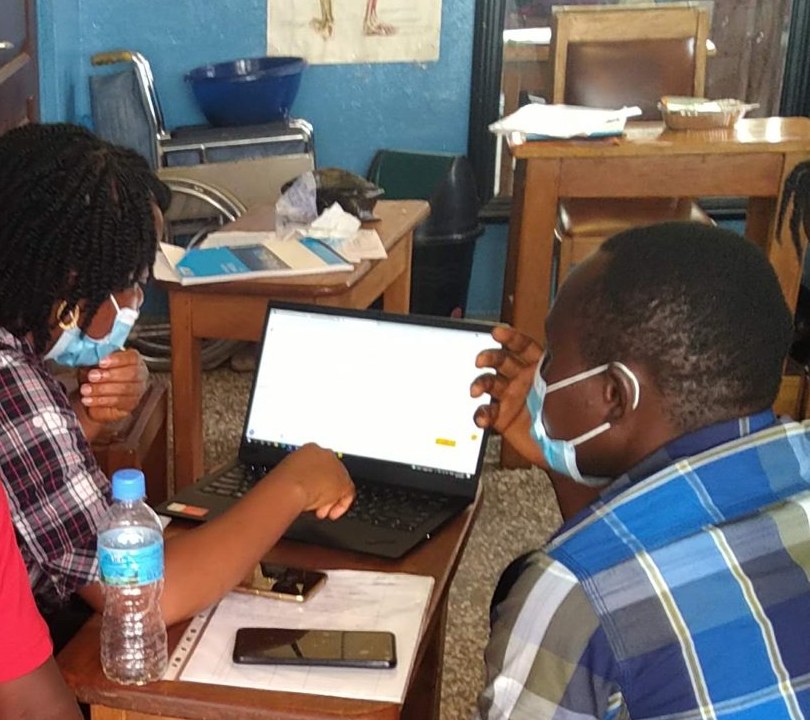 Field staff using the case-management app on their phones during clinic training
